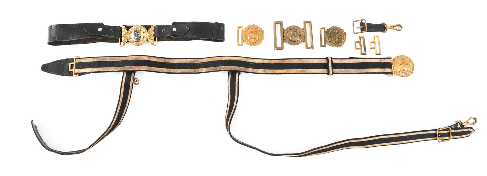 WWI - COLD WAR BRITISH BELTS & BELT BUCKLES: WWI - COLD WAR BRITISH BELTS & BELT BUCKLES Lot of 5 WWI - Cold War British Belts & Belt Buckles. (1) Royal Navy Sword Belt & Buckle. Maker marked by Gieves Limited. Black leather construction. Brass 