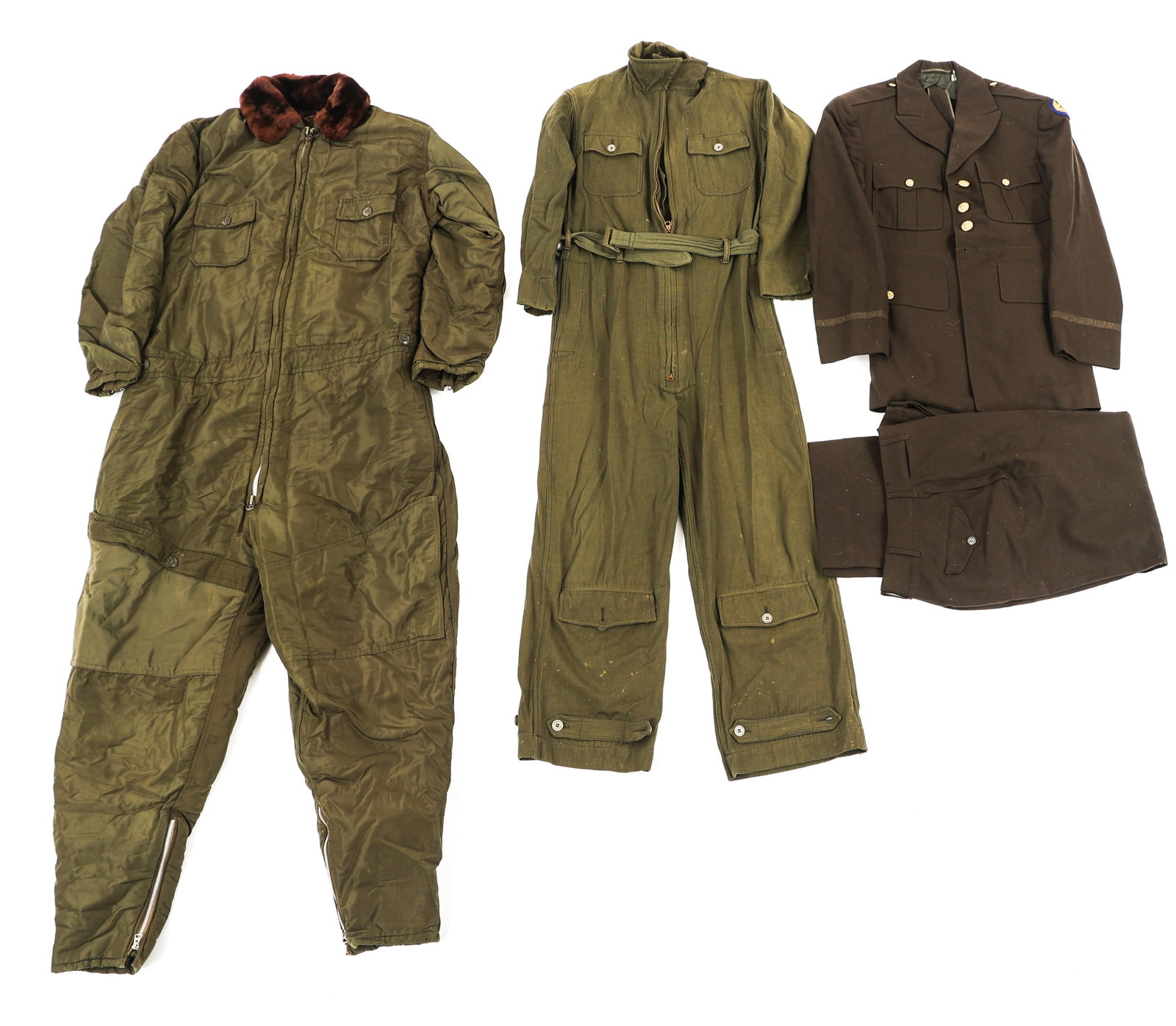 WWII US AAF - USN FLIGHT SUIT AND UNIFORM LOT: WWII US AAF - USN FLIGHT SUIT AND UNIFORM LOT Lot of WWII US AAF & USN Flight Suit Items. (1) AN 6550 Flight Suit. Fine wool construction. Conmar Zipper. (1) USN AL-1 Coveralls. Nylon and fur construc