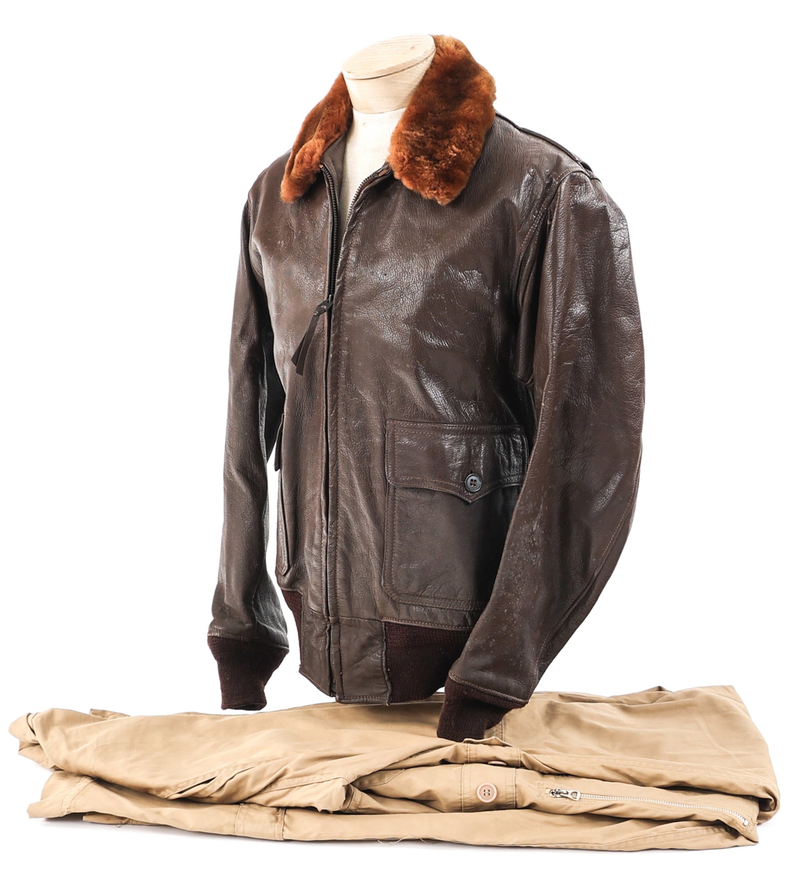 WWII - COLD WAR US NAVY FLIGHT SUIT & G-1 JACKET: WWII - COLD WAR US NAVY FLIGHT SUIT & G-1 JACKET WWII - Cold War US Navy Flight Suit & Jacket. (1) Type G-1 leather flight jacket. No tags or stamps visible. (1) MIL-S-5390B khaki summer flight suit, 