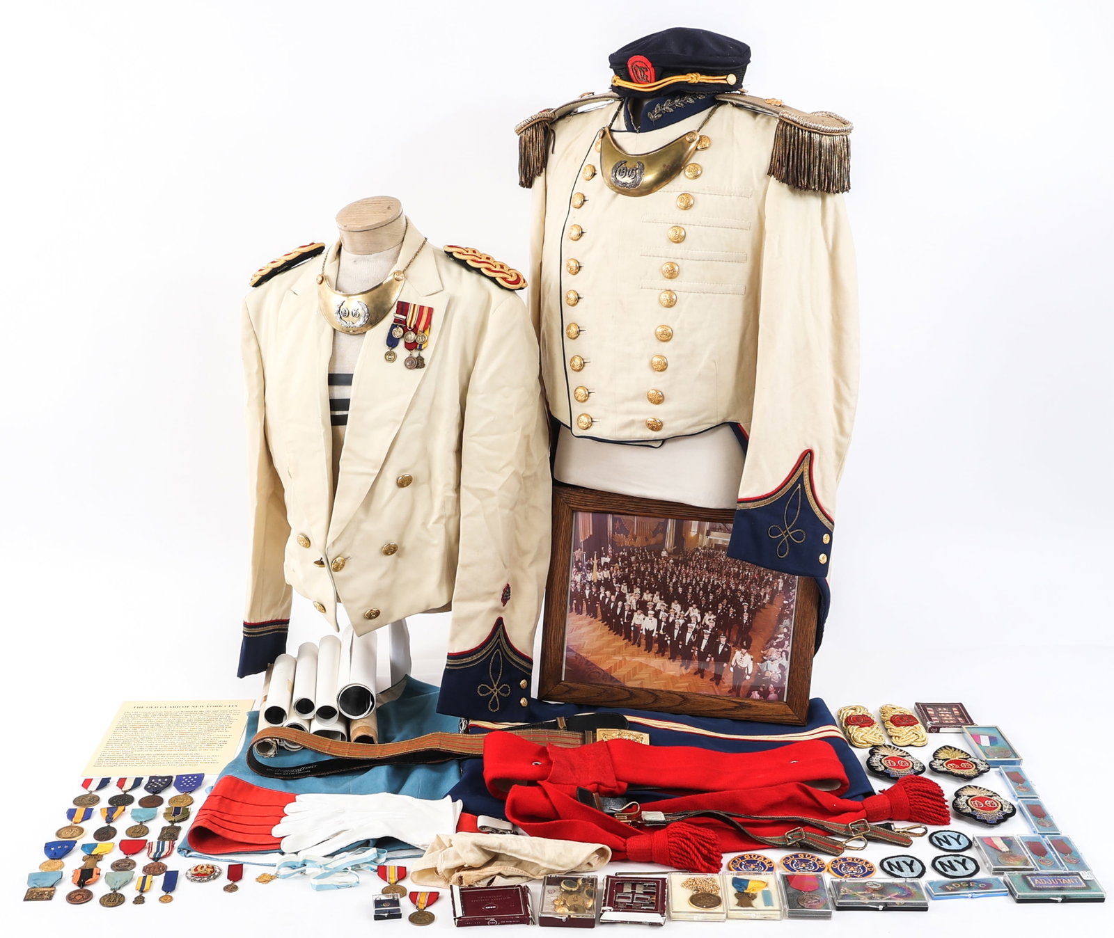 COLD WAR US OLD GUARD OF NYC UNIFORM GROUPING: COLD WAR US OLD GUARD OF NYC UNIFORM GROUPING Cold War US Old Guard of New York City Uniform, Insignia, and Photograph Grouping. Includes two dress tunics/ coats, pair of trousers, belt, light blue ve