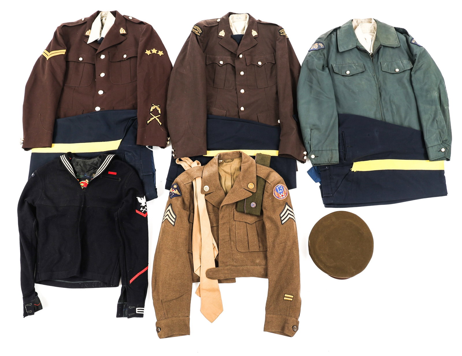 WWII - COLD WAR US & CANADIAN UNIFORMS: WWII - COLD WAR US & CANADIAN UNIFORMS WWII - Cold War US and Canada Uniforms. (2) Royal Canadian Mounted Police 1955 Corporal Uniforms. (4) RCMP shirts, three with clip ties. (1) RCMP nylon jacket wi