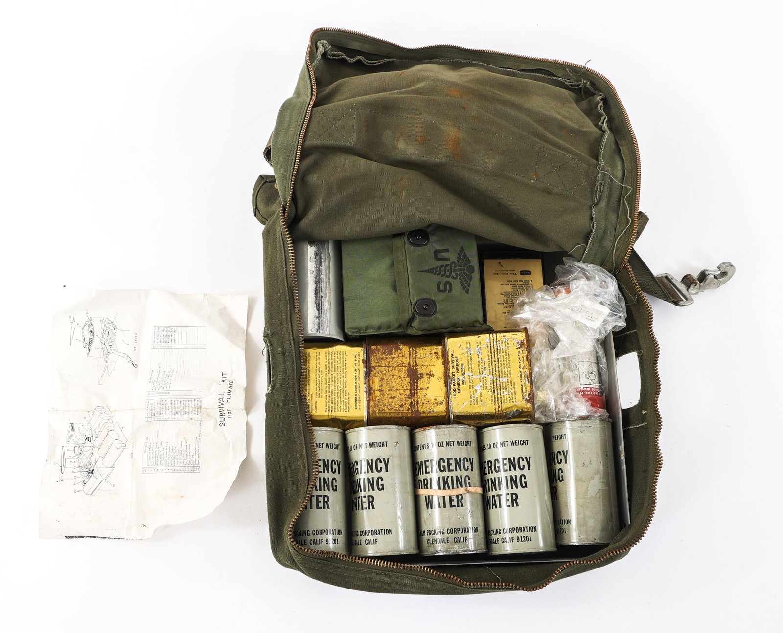 VIETNAM WAR US HOT CLIMATE SURVIVAL KIT: VIETNAM WAR US HOT CLIMATE SURVIVAL KIT Vietnam War US Hot Climate Survival Kit. Maker mark present but faded. Dated September 1966. Contents include six emergency water rations, three emergency food 
