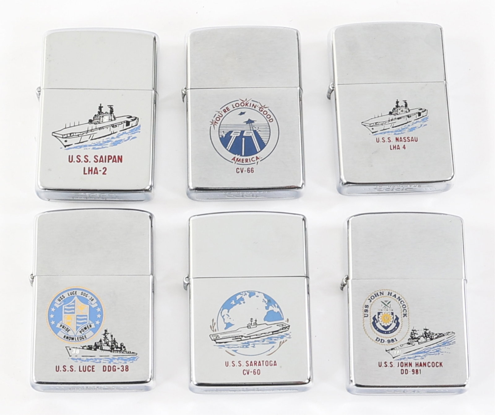 COLD WAR US NAVY ZIPPO LIGHTER LOT OF 6: COLD WAR US NAVY ZIPPO LIGHTER LOT OF 6 Lot of 6 Cold War - Current US Navy Zippo Cigarette Lighters. (1) USS Saratoga CV-60 Lighter. (1) USS America CV-66 Lighter. (1) USS Saipan LHA-2 Lighter. (1) U