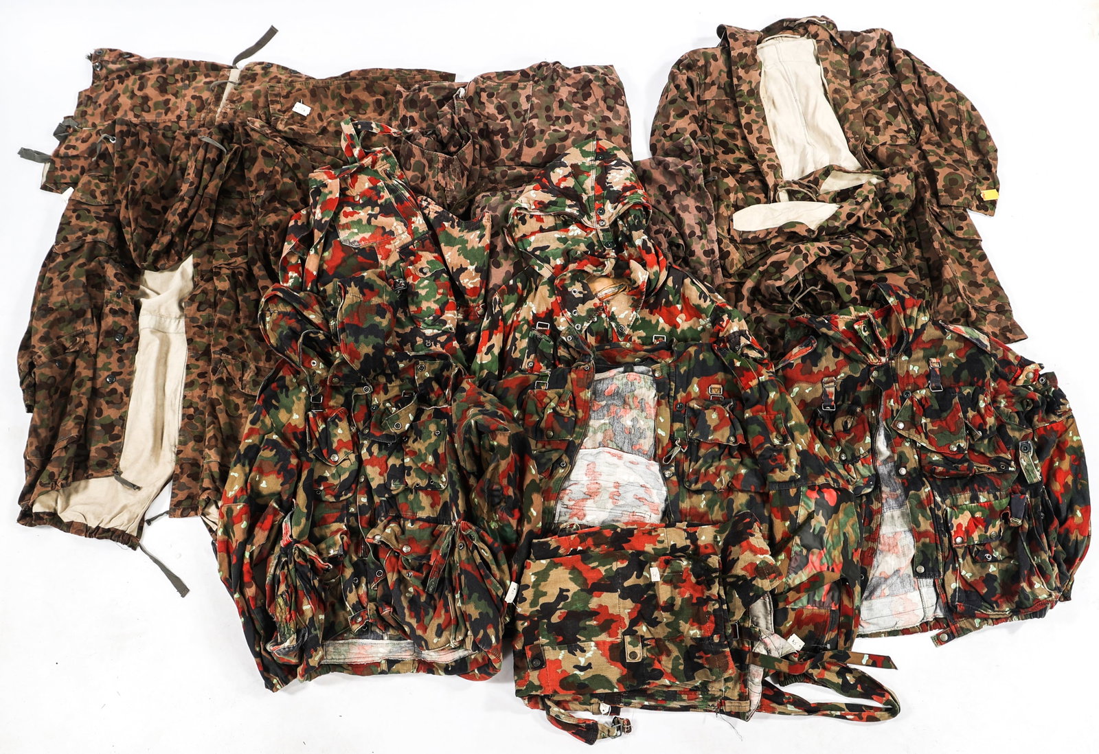 COLD WAR SWISS & AUSTRIAN CAMO UNIFORM ITEMS: COLD WAR SWISS & AUSTRIAN CAMO UNIFORM ITEMS Cold War Swiss & Austrian Camouflage Uniform Items. Includes Leibermuster and Pea Pattern smocks, pants, and jackets. Size: Small to Large