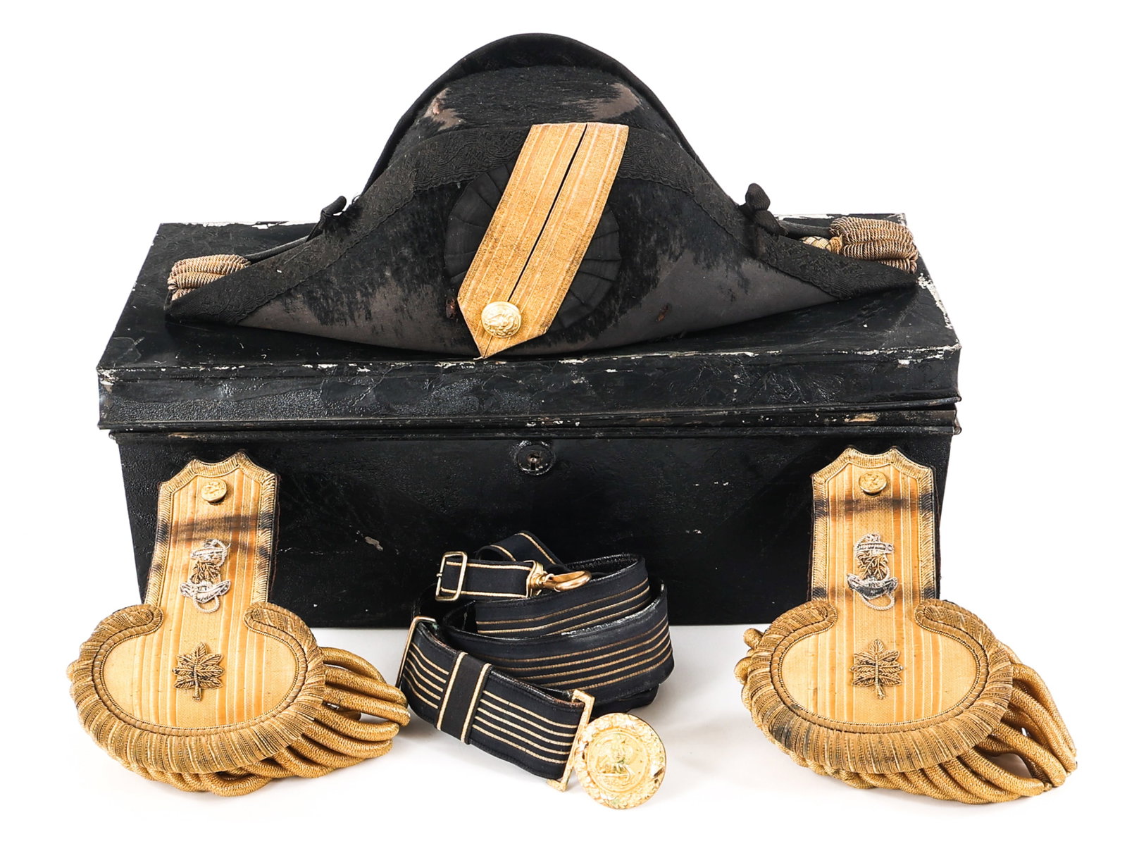 US NAVY BICORNE HAT / EPAULETTES & SWORD BELT: US NAVY BICORNE HAT / EPAULETTES & SWORD BELT Early 20th C. US Navy Bicorne Hat, Epaulettes, Sword Belt, and Black Metal Storage Box. (1) Black bicorne hat with brass button. Leather sweatband. Maker 