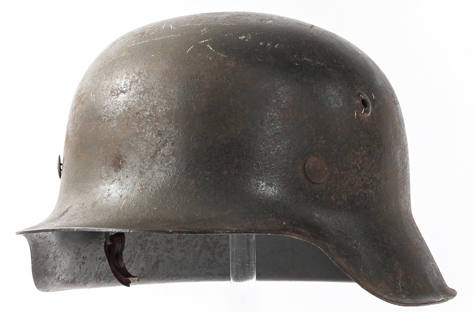 WWII GERMAN M42 HELMET by SACHSISCHE EMAILLER: WWII GERMAN M42 HELMET by SACHSISCHE EMAILLER WWII German M42 Helmet by Sachsische Emailler. Maker mark stamped "Hkp64" and serial numbered "425C" near the brim. Eight tongue leather liner. Chinstrap 