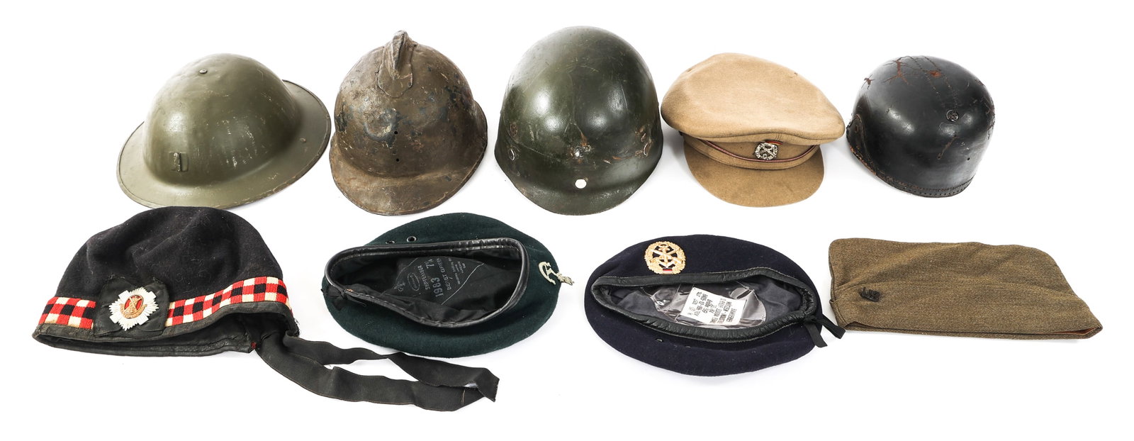 WWI - WWII WORLD MILITARY HEADGEAR: WWI - WWII WORLD MILITARY HEADGEAR WWI - WWII World Military Headgear. Including M1 helmet liner, berets, US garrison cap, British MkI helmet, Belgian Artillery service cap and more.