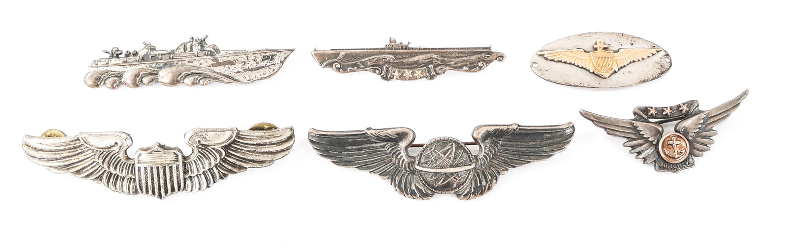 WWII USAAF & NAVY SUB / PT BOAT & AVIATION WINGS: WWII USAAF & NAVY SUB / PT BOAT & AVIATION WINGS WWII USAAF / Navy Submarine and PT Boat Pins, Aviator, Navigator and Aircrew Wings. (1) PT Boat pin. Pin back, marked "Sterling" on the reverse. (1) 3-