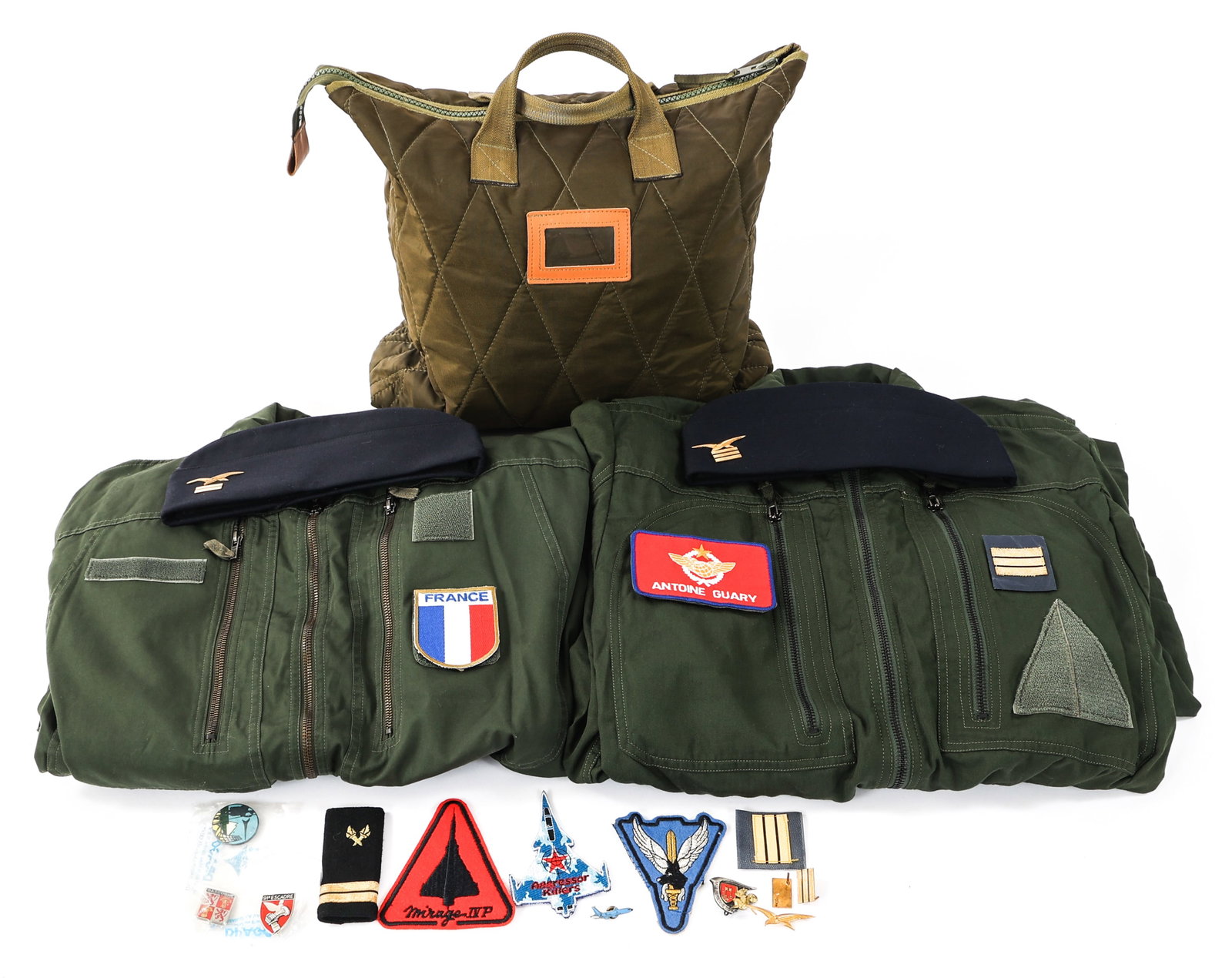 FRENCH NAMED MIRAGE PILOT FLIGHT SUIT & INSIGNIA: FRENCH NAMED MIRAGE PILOT FLIGHT SUIT & INSIGNIA Modern French Air Force 91st Bombardment Wing Mirage IV P Pilot Flight Suit and Insignia Grouping. Named to Captain Antoine Guary. (2) Flights suits wi