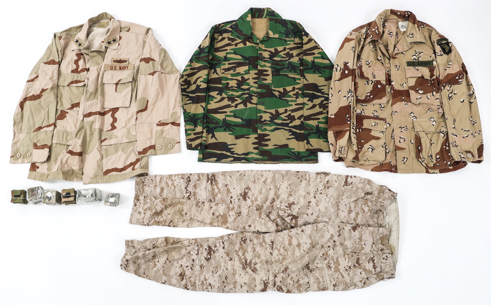 DESERT STORM - CURRENT US ARMY & NAVY UNIFORMS: DESERT STORM - CURRENT US ARMY & NAVY UNIFORMS Desert Storm - Current US Army & Navy Uniforms and Officer Rank Patches. (1) US Army 101st Airborne Chocolate Chip Camouflage coat. (1) Woodland Camoufla