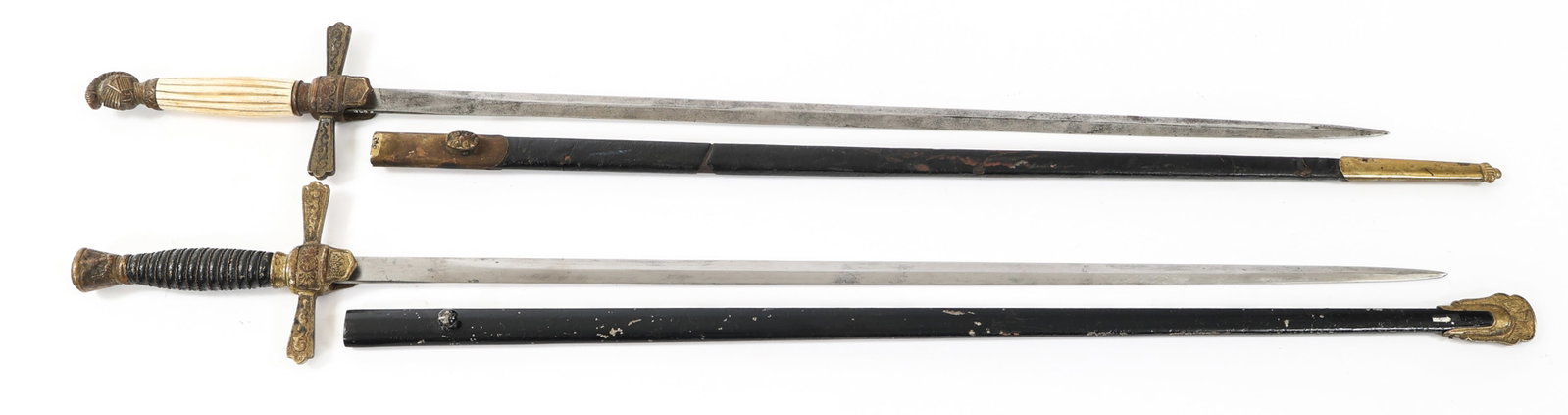 CIVIL WAR ERA US MILITIA NCO SWORDS: CIVIL WAR ERA US MILITIA NCO SWORDS Civil War Era US Militia NCO Swords. (1) NCO Sword. Double edged blade. No visible marks. Gilded brass hilt with leather wrapped handle. Leather scabbard. (1) NCO S