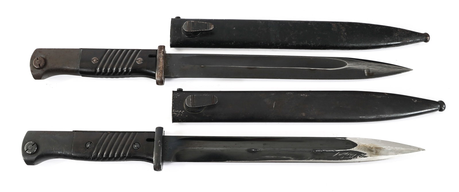 WWII GERMAN K98 COMBAT BAYONETS: WWII GERMAN K98 COMBAT BAYONETS WWII German K98 Bayonets. (1) K98 Bayonet with blued blade. Maker marked "42crs". Steel hilt with composite grip. Waffenamt stamps on the pommel. Steel scabbard. (1) K9