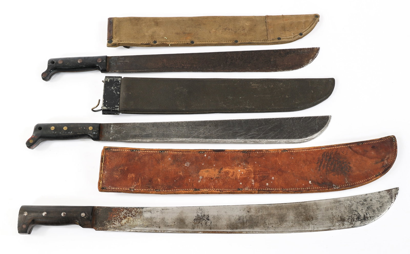 WWII US ARMY M1942 & COLLINS & CO M1939 MACHETES: WWII US ARMY M1942 & COLLINS & CO M1939 MACHETES WWII US Army M1942 and Legitimus Collins & CO. Machetes. (1) True Temper Machete. Dated 1943. Blued blade with black composite grips. Canvas scabbard.