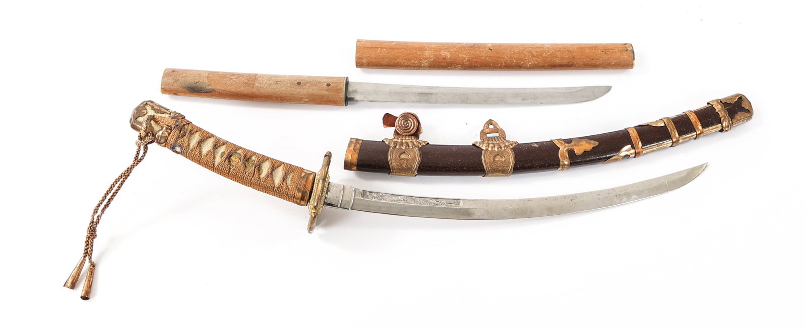 20th C. MINIATURE JAPANESE SWORDS: 20th C. MINIATURE JAPANESE SWORDS (1) Mini Sword. Curved blade with Hamon and dragon design etched near the spine. No visible maker marks. Gilded tsuba. Faux ray skin and fabric wrapped tsuka. Decorat
