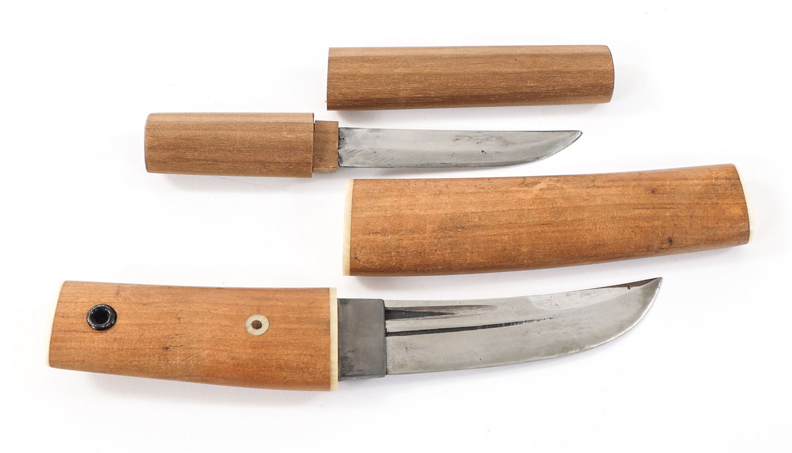 20th C. MINIATURE JAPANESE DAGGERS: 20th C. MINIATURE JAPANESE DAGGERS 20th Century Miniature Japanese Daggers. (1) Mini Dagger. Single edged, slightly curved blade with Hamon. No visible maker marks. Wood Tsuka and Saya. (1) Mini Dagge