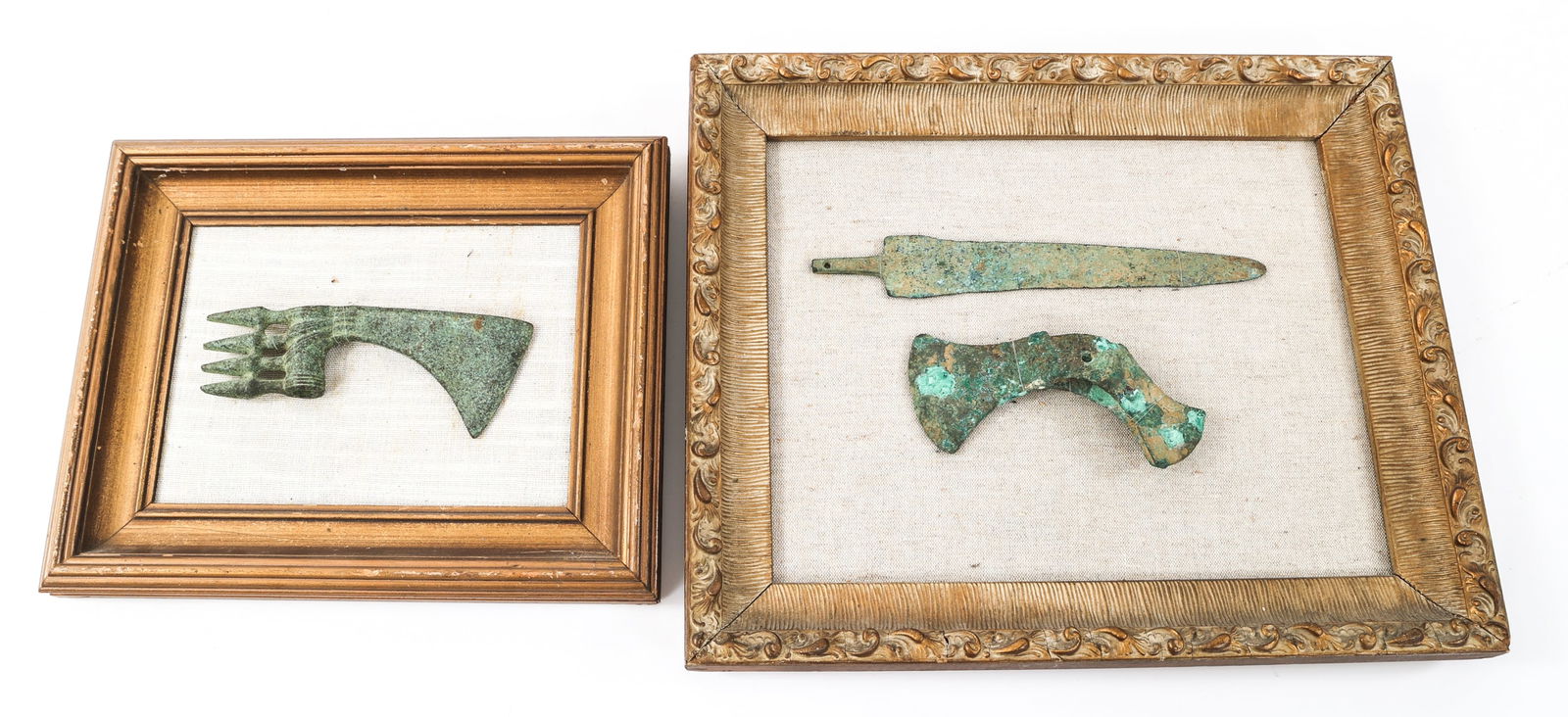 CONTEMPORARY BRONZE DISPLAY AXE HEADS & DAGGER: CONTEMPORARY BRONZE DISPLAY AXE HEADS & DAGGER Framed Contemporary Bronze Display Axe Heads and Dagger. Frame sizes: 10 1/2" to 14" x 13" to 7" Blade Length: 3" to 9" | Total Length: 7" to 11"