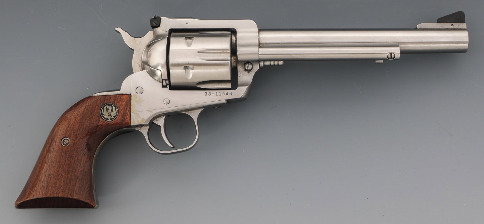 RUGER NEW MODEL BLACKHAWK .357 MAG REVOLVER: RUGER NEW MODEL BLACKHAWK .357 MAG REVOLVER 1976 Ruger New Model Blackhawk .357 magnum caliber SA revolver. Stainless steel finish. Ramp front sight. Adjustable rear sight. 6 shot fluted cylinder. Woo