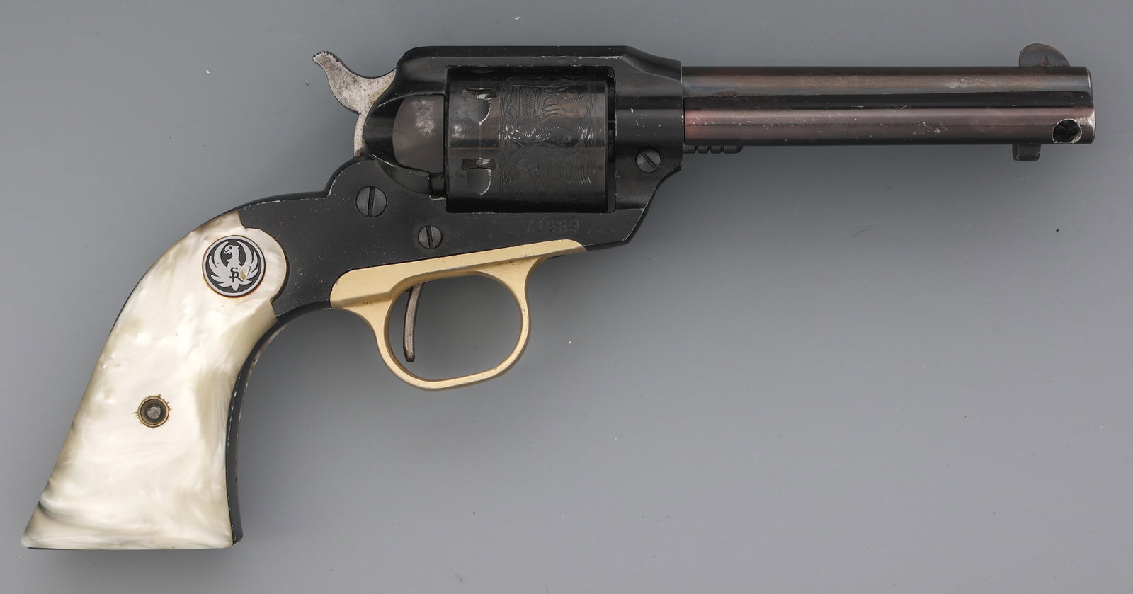 1966 RUGER BEARCAT .22 LR CALIBER SA REVOLVER: 1966 RUGER BEARCAT .22 LR CALIBER SA REVOLVER 1966 Ruger Bearcat .22 LR caliber single action revolver. Bear and cat scene scrolled on cylinder. Blued finish. Faux mother of pearl grips. Caliber / Gau