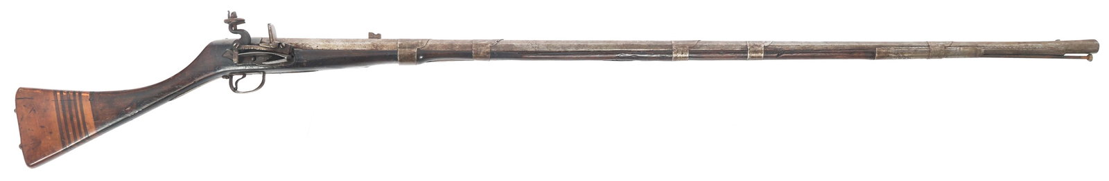 NORTH AFRICAN MOUKHALA FLINTLOCK MUSKET: NORTH AFRICAN MOUKHALA FLINTLOCK MUSKET North African Moukhala flintlock musket. 15mm bore. 58" total length. Engraved side plate and forward barrel plate. Saddle ring. Laminated wood buttstock. Calib