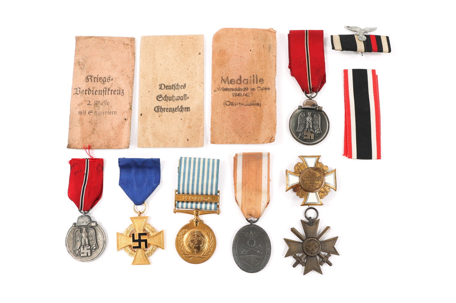 WWI - WWII GERMAN CAMPAIGN MEDALS & BADGES: WWI - WWII GERMAN CAMPAIGN MEDALS & BADGES WWI - WWII German Campaign Medals and Badges. (1) WWI Prussian War Veteran's Honor Cross, 1st Class. (2) Winter Campaign in Russia Medals. (1) 40 Year Faithf
