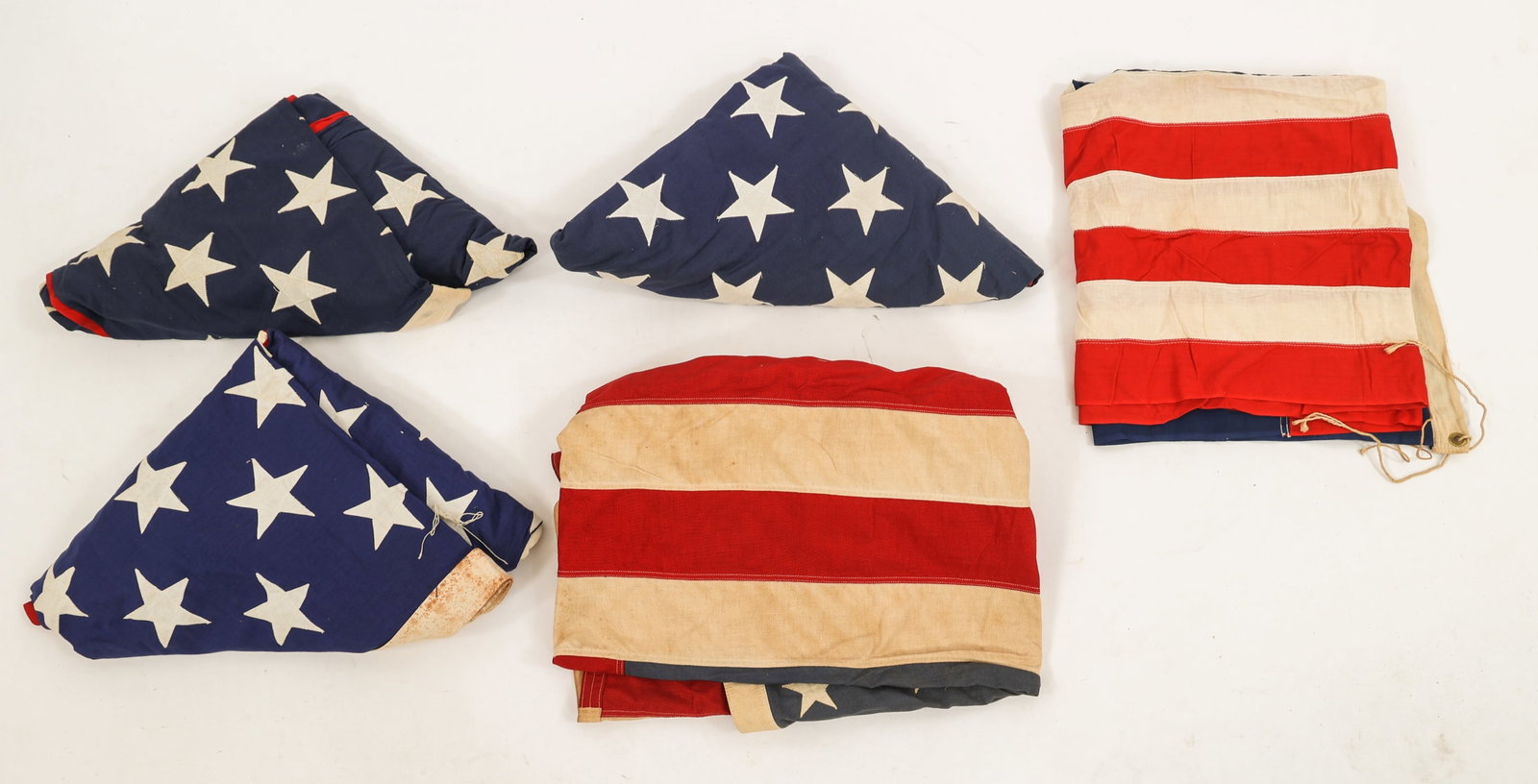 COLD WAR ERA US 50 STAR FLAG LOT OF 5: COLD WAR ERA US 50 STAR FLAG LOT OF 5 Lot of 5 US 50 Star Flags. (5) Cotton, multi-piece construction with stitched stars. Makers include Valley Forge Flag Company, Everwear Bunting and Miami Garment 