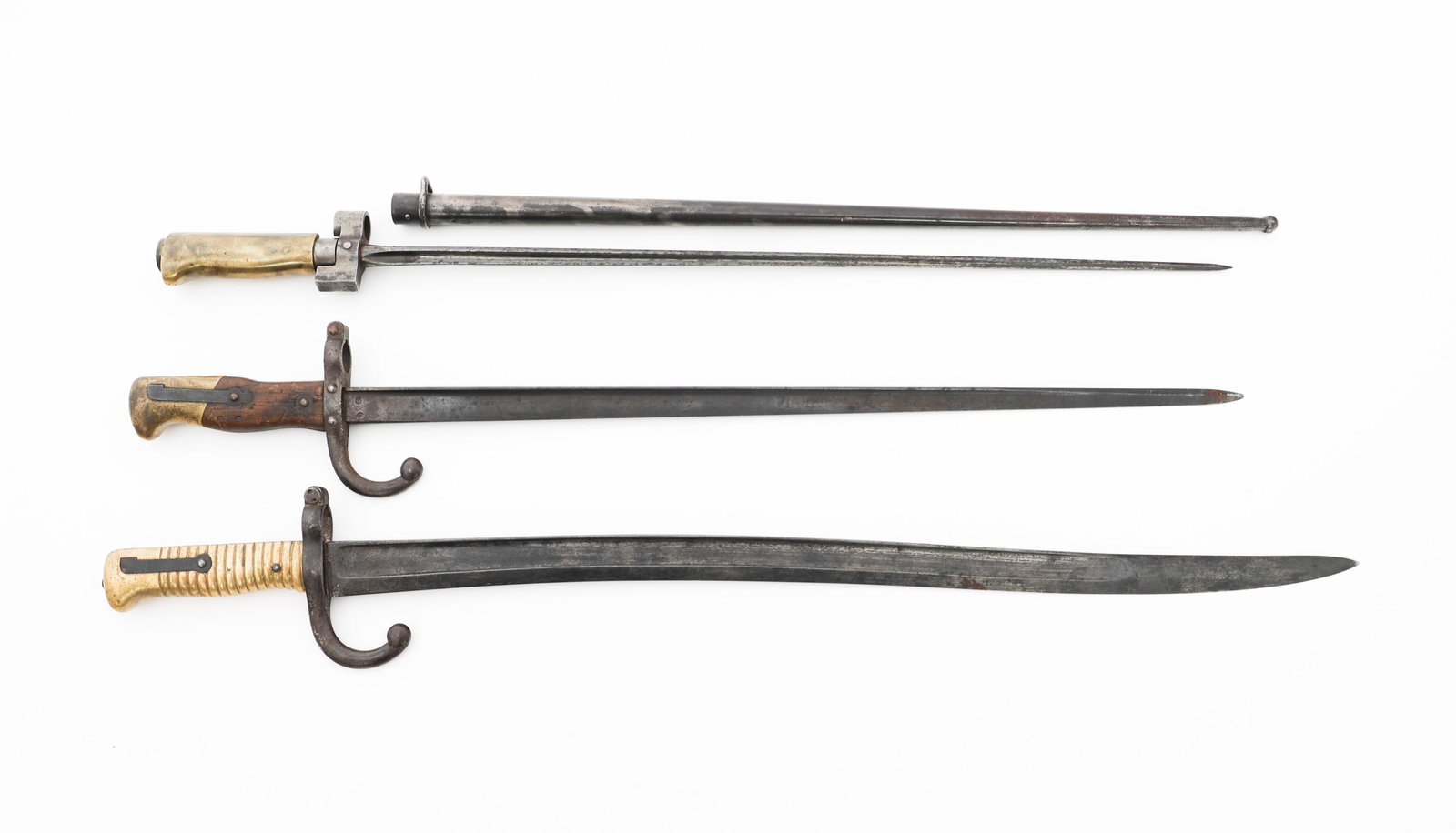 FRENCH M1866, M1874, & M1886 BAYONETS: FRENCH M1866, M1874, & M1886 BAYONETS French M1866, M1874, and M1886 Bayonets. (1) M1866 Yataghan Bayonet. Maker marked by Manufacture Imp?riale de Tulle and dated 1868 on the spine. No scabbard. (1) 