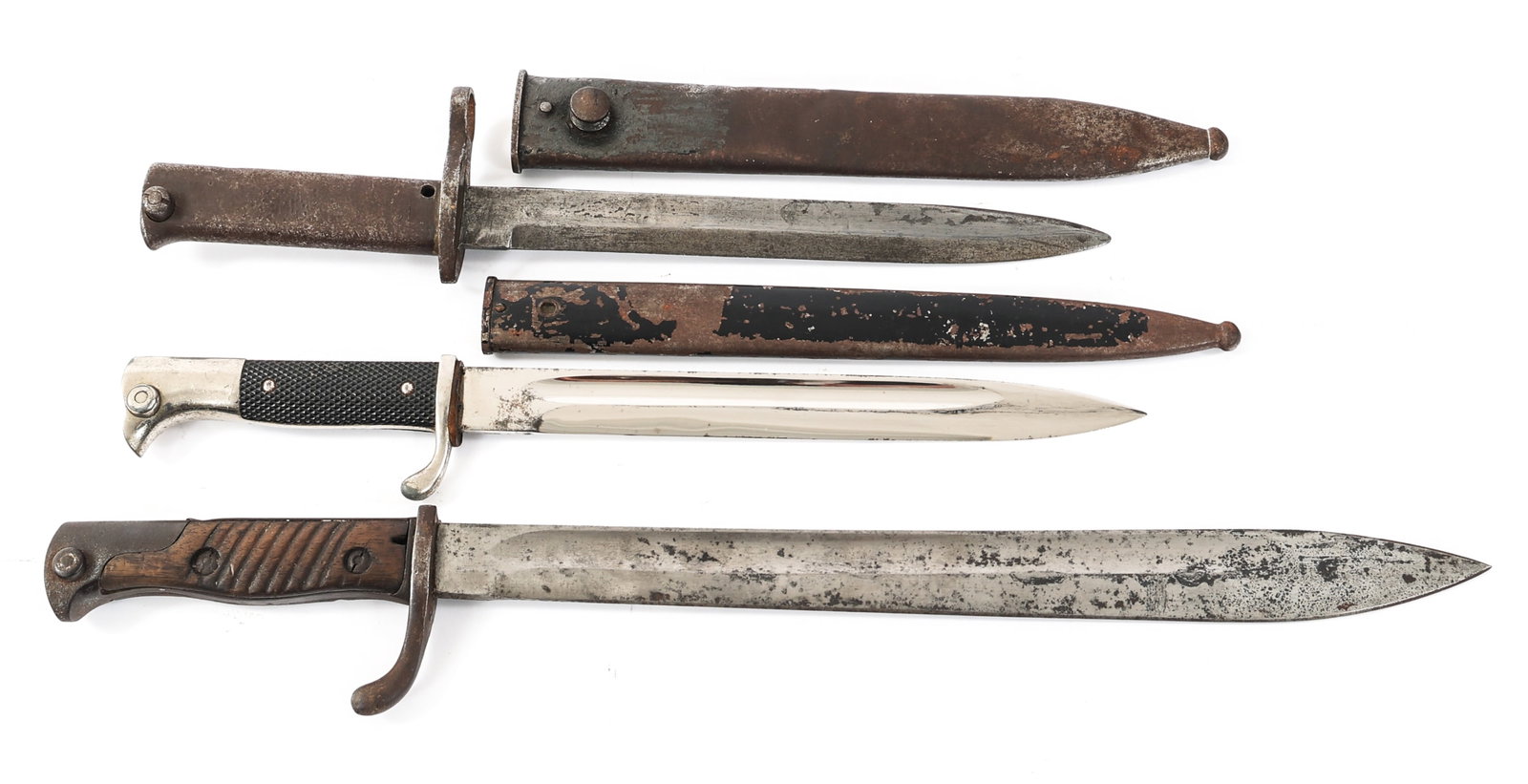 WWI - WWII GERMAN BAYONETS: WWI - WWII GERMAN BAYONETS WWI - WWII German Bayonets. (1) WWII German K98 Dress Bayonet. Single edged bright blade with fuller. Maker mark of Carl Eickhorn stamped on the ricasso. Nickel-silver plate