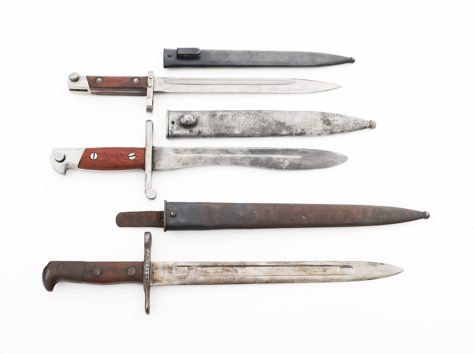 WWI - WWII AUSTRIAN, SWISS, & SPANISH BAYONETS: WWI - WWII AUSTRIAN, SWISS, & SPANISH BAYONETS WWI - WWII Austrian, Swiss and Spanish Bayonets. (1) Austrian M1895 Bayonet. Inverted blade. Maker mark and "CEWG" stamped on the ricasso. Steel scabbard