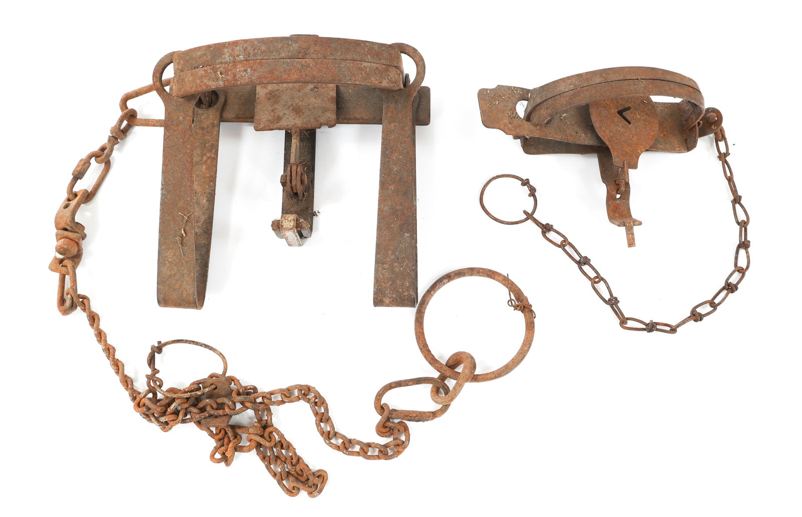 19th C. - WWII STEEL BEAR TRAPS: 19th C. - WWII STEEL BEAR TRAPS 19th C. - WWII Steel Bear Traps. (2) Steel construction bear traps. Includes chains with rings. No visible markings or stamps. Size: 10" to 23 1/2"
