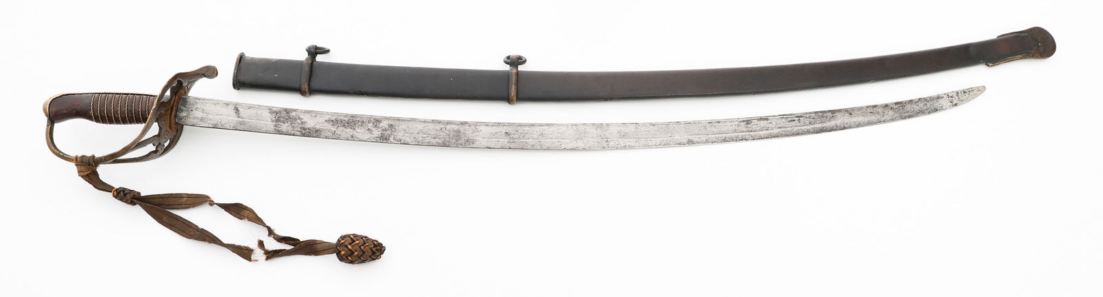 CIVIL WAR CONFEDERATE NASHVILLE PLOW WORKS SWORD: CIVIL WAR CONFEDERATE NASHVILLE PLOW WORKS SWORD Civil War Confederate Nashville Plow Works Sword. Single edged, curved blade with fuller. Leather buffer pad present. Cast brass hilt maker marked in r