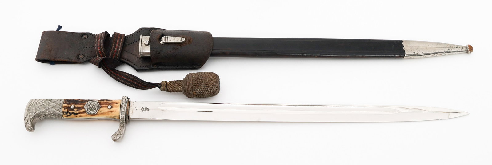 WEIMAR REPUBLIC POLICE BAYONET by WKC: WEIMAR REPUBLIC POLICE BAYONET by WKC German Weimar Republic Police Dress Bayonet. Single edged, bright blade with fuller. Maker mark of WKC on the ricasso. Nickel-silver guard and hilt. Stag horn gri