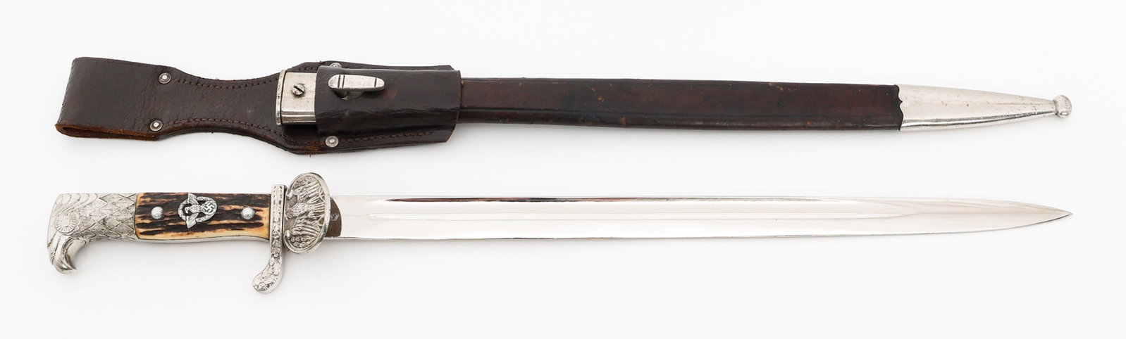 WEIMAR REPUBLIC POLICE CLAMSHELL BAYONET by WKC: WEIMAR REPUBLIC POLICE CLAMSHELL BAYONET by WKC German Weimar Republic Police Clamshell Dress Bayonet. Single edged, bright blade with fuller. Maker mark of WKC on the ricasso. Leather buffer pad pres