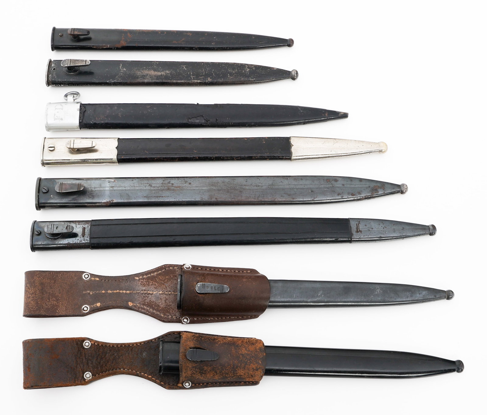 WWI - WWII GERMAN DRESS & COMBAT BAYONET SCABBARDS: WWI - WWII GERMAN DRESS & COMBAT BAYONET SCABBARDS WWI - WWII German Dress & Combat Bayonet Scabbards. (8) Bayonet Scabbards. Two have leather frogs. Total Length: 10 3/4" to 16" Provenance: Lifetime 