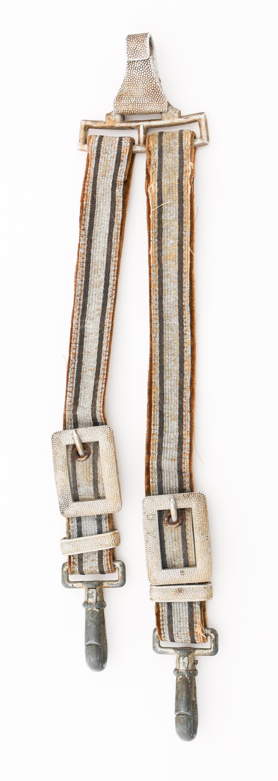 WWII GERMAN SOCIAL WELFARE LEADER'S DAGGER HANGER: WWII GERMAN SOCIAL WELFARE LEADER'S DAGGER HANGER WWII German Social Welfare Leader's Dress Dagger Hanger. Dark grey and aluminum thread construction with tan felt backing. Pebbled plated alloy clips 