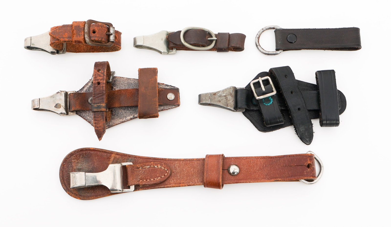 WWII GERMAN SS & SA DRESS DAGGER & SWORD HANGERS: WWII GERMAN SS & SA DRESS DAGGER & SWORD HANGERS WWII German SS & SA Dress Dagger & Sword Hangers. (1) SS Enlisted Dress Dagger Vertical Leather Hanger. German eagle over "SS" stamped on the front. St