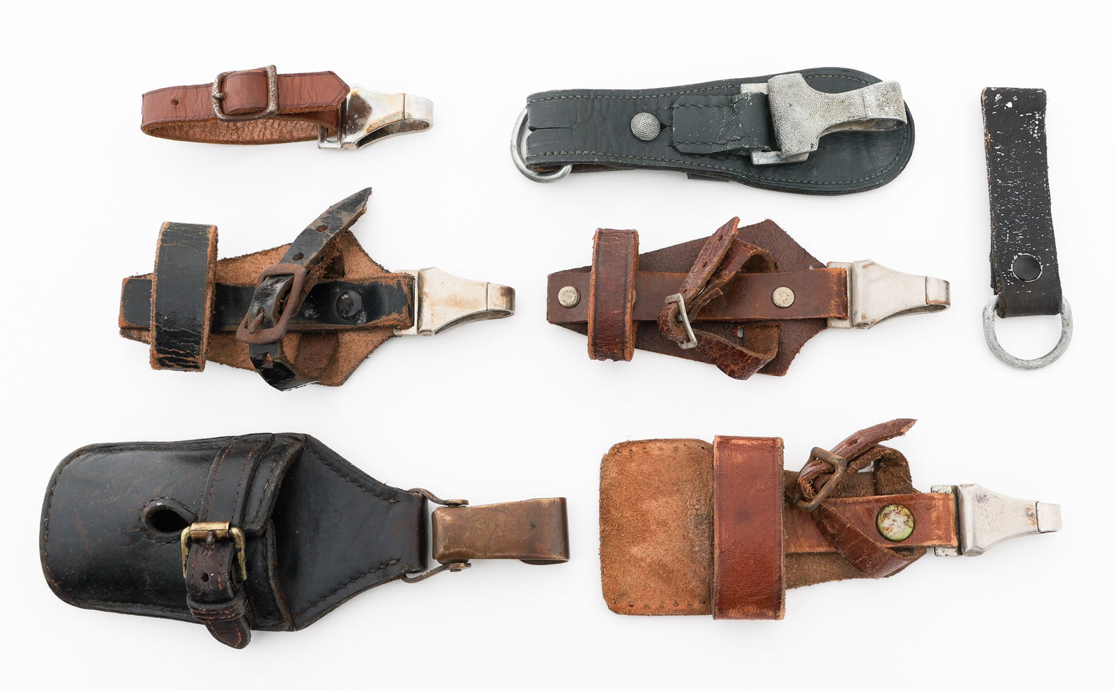 WWII GERMAN SS DAGGER, BAYONET & SWORD HANGERS: WWII GERMAN SS DAGGER, BAYONET & SWORD HANGERS WWII German Dress Dagger, Bayonet & Sword Hangers. (1) SS Enlisted Dress Dagger Vertical Leather Hanger. Steel clip with "DRGM" stamp. (2) SA Dress Dagge