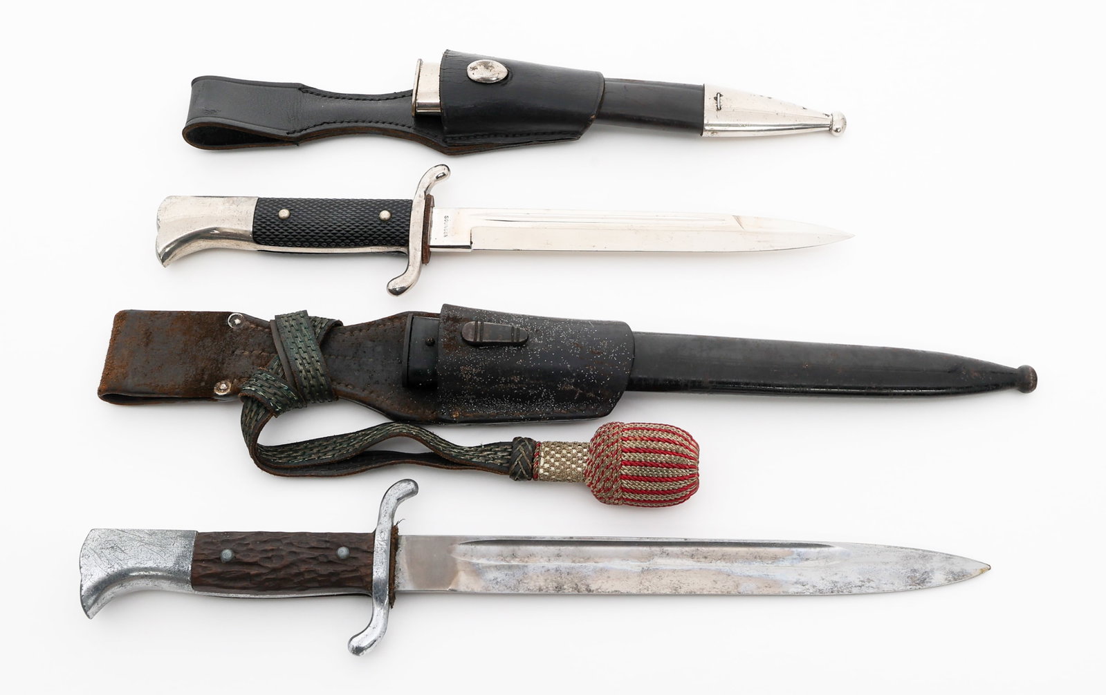 WWII GERMAN K98 OFFICER & EM FIREMAN BAYONETS: WWII GERMAN K98 OFFICER & EM FIREMAN BAYONETS WWII German K98 Officer and Enlisted Man Fireman Bayonets. (1) Fireman Officer's K98. Single edged, bright blade with fuller. No visible maker mark. Leath