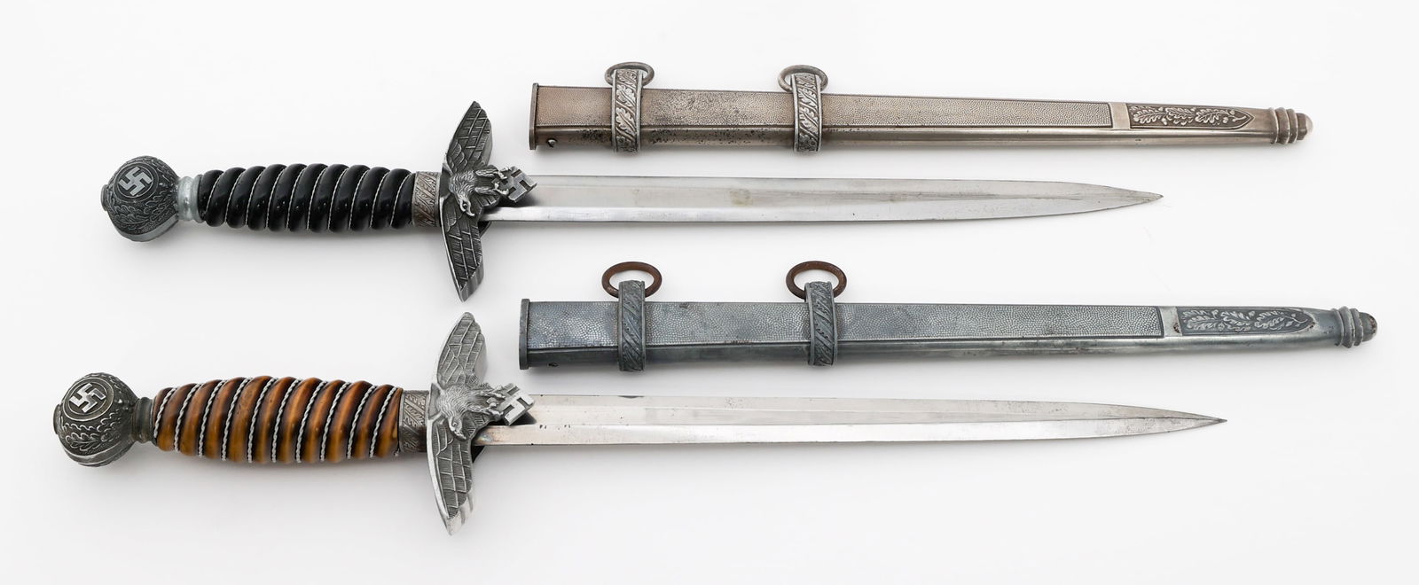 WWII GERMAN LUFTWAFFE PARTS DAGGERS: WWII GERMAN LUFTWAFFE PARTS DAGGERS WWII German Luftwaffe Parts Daggers. (2) Luftwaffe Parts Daggers. One is maker marked by Alcoso and the other by Robert Klaas. Both have scabbards. Mix of original,