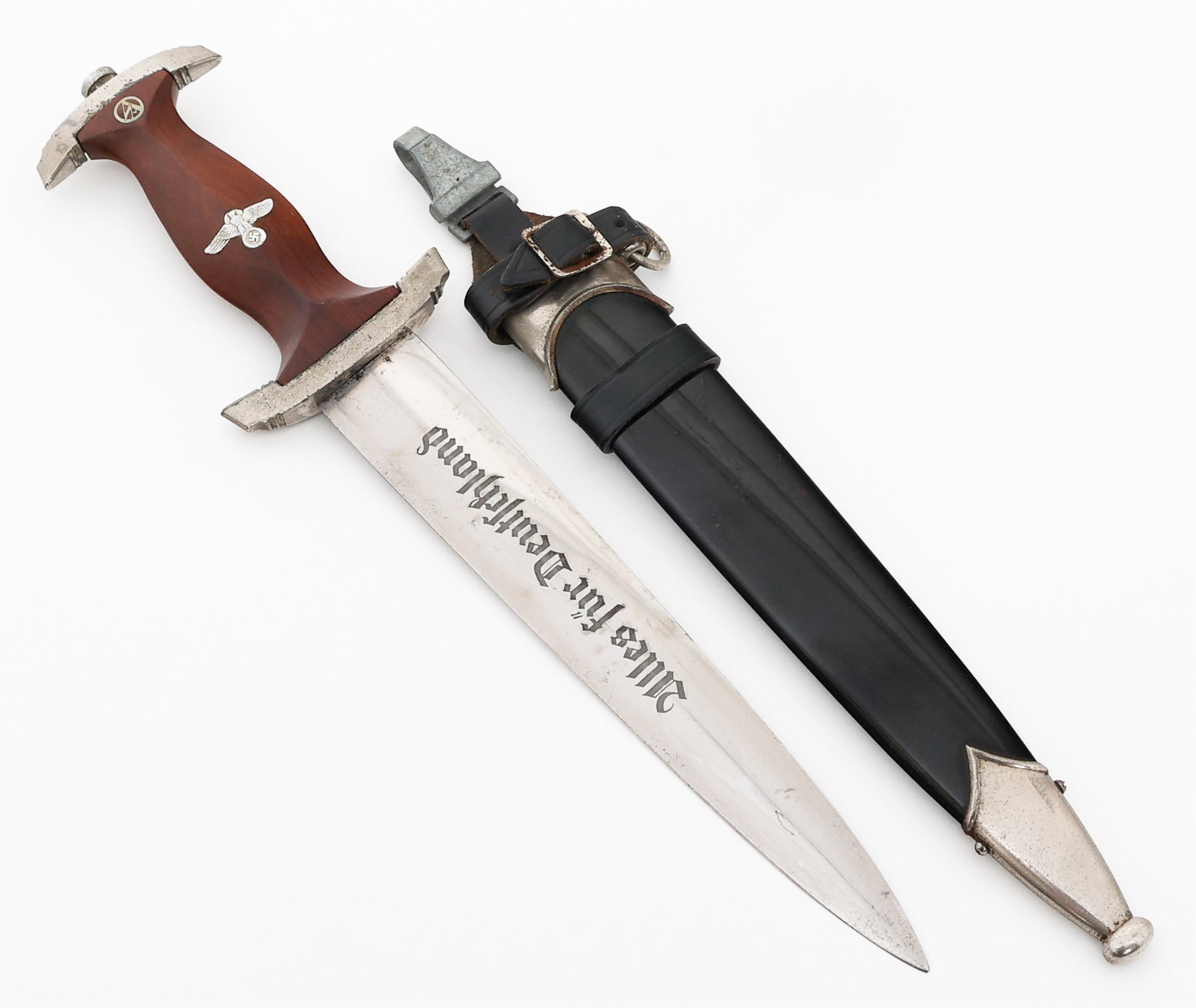 WWII GERMAN NSKK DRESS DAGGER by PUMA: WWII GERMAN NSKK DRESS DAGGER by PUMA WWII German NSKK Transitional Dress Dagger. Double edged, bright blade with acid etched motto "Alles Fur Deutschland" in dark grey background. Visible crossgrain.