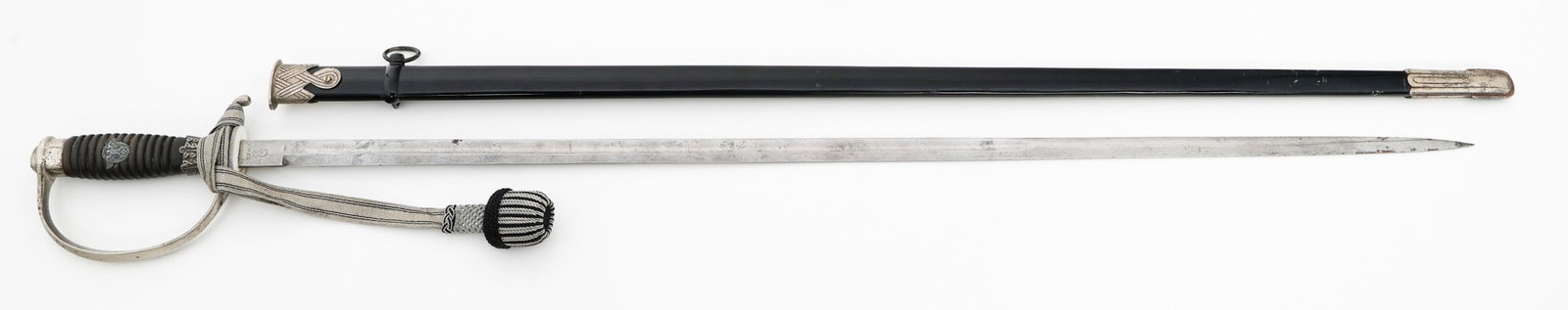 WWII GERMAN SS POLICE NCO DEGEN SWORD by WKC: WWII GERMAN SS POLICE NCO DEGEN SWORD by WKC WWII German SS Police NCO Degen Sword. Single edged, bright blade with fuller. Maker marked by WKC on the ricasso and SS Kulturzeichen runes on the reverse