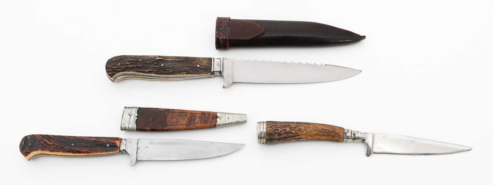 GERMAN STAG HORN PICNIC KNIVES: GERMAN STAG HORN PICNIC KNIVES German Stag Horn Picnic Knives. (1) Picnic Knife. Single edged, bright blade with sawback spine and stag horn handle. Maker marked by Anton Wingen Jr. Leather sheath. (1