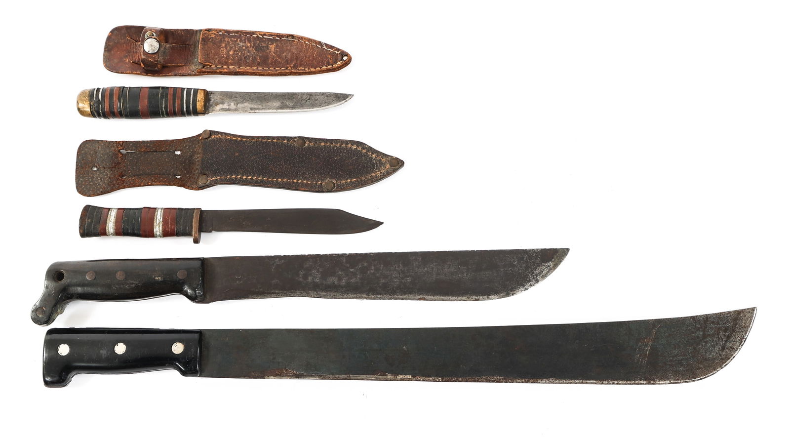 WWII US THEATER MADE FIGHTING KNIVES & MACHETES: WWII US THEATER MADE FIGHTING KNIVES & MACHETES WWII US Theater Made Fighting Knives & Machetes. (2) US Theater Made Fighting Knives. No visible markings or stamps on the blade. Brass hilts with stack