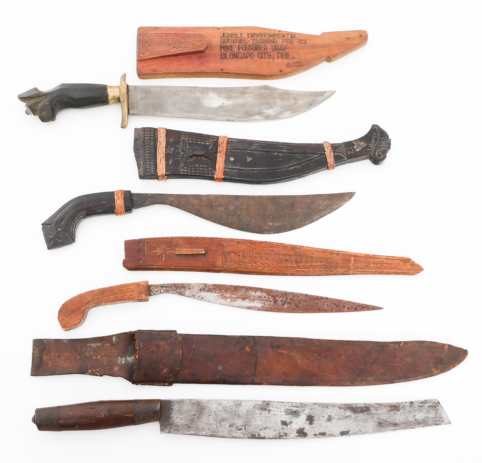 WWII VET BRING BACK SOUTHEAST ASIAN KNIVES: WWII VET BRING BACK SOUTHEAST ASIAN KNIVES WWII Veteran Bring Back Southeast Asian Fighting Knives. (1) Talibon. Wood scabbard with "USA" carved near the throat. (1) Talibon. Wood scabbard. (1) Golok.