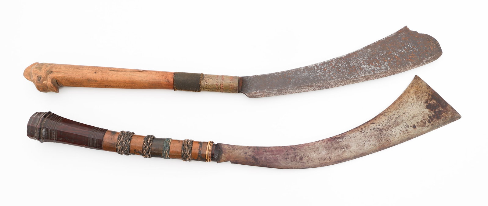 SOUTHEAST ASIAN PANABAS SHORT SWORDS: SOUTHEAST ASIAN PANABAS SHORT SWORDS Southeast Asian Panabas Short Swords. (2) Panabas. Single edged, curved blades. Wooden handles with brass fittings. No scabbards. Blade Length: 14" to 15 3/4" Tota