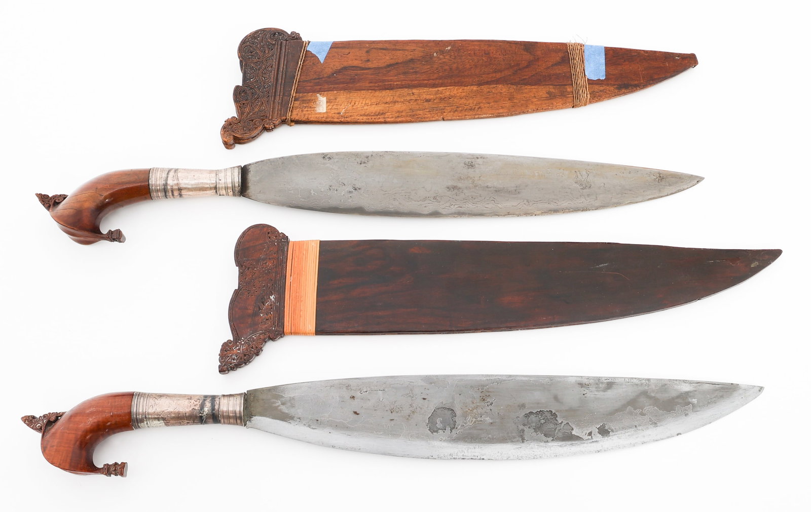 SOUTHEAST ASIAN BARONGS WITH SCABBARDS: SOUTHEAST ASIAN BARONGS WITH SCABBARDS Southeast Asian Barongs. (2) Barong. Single edged, leaf shaped blade. Wooden handle and scabbard. Blade Length: 15 3/4", 16 1/8" Total Length: 22 1/2", 22 3/4"
