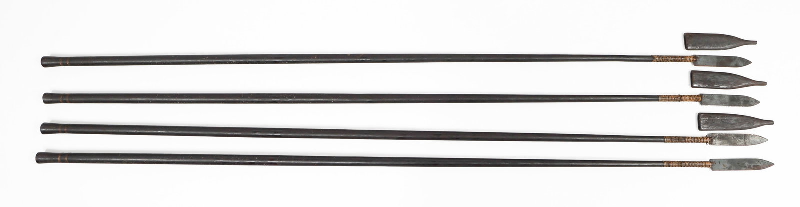 SOUTHEAST ASIAN TRIBAL BLOW DART SPEARS: SOUTHEAST ASIAN TRIBAL BLOW DART SPEARS Southeast Asian Tribal Blow Dart Spears. Steel blades and wooden shafts. Three have scabbards. Blade Length: 7" Total Length: 78"