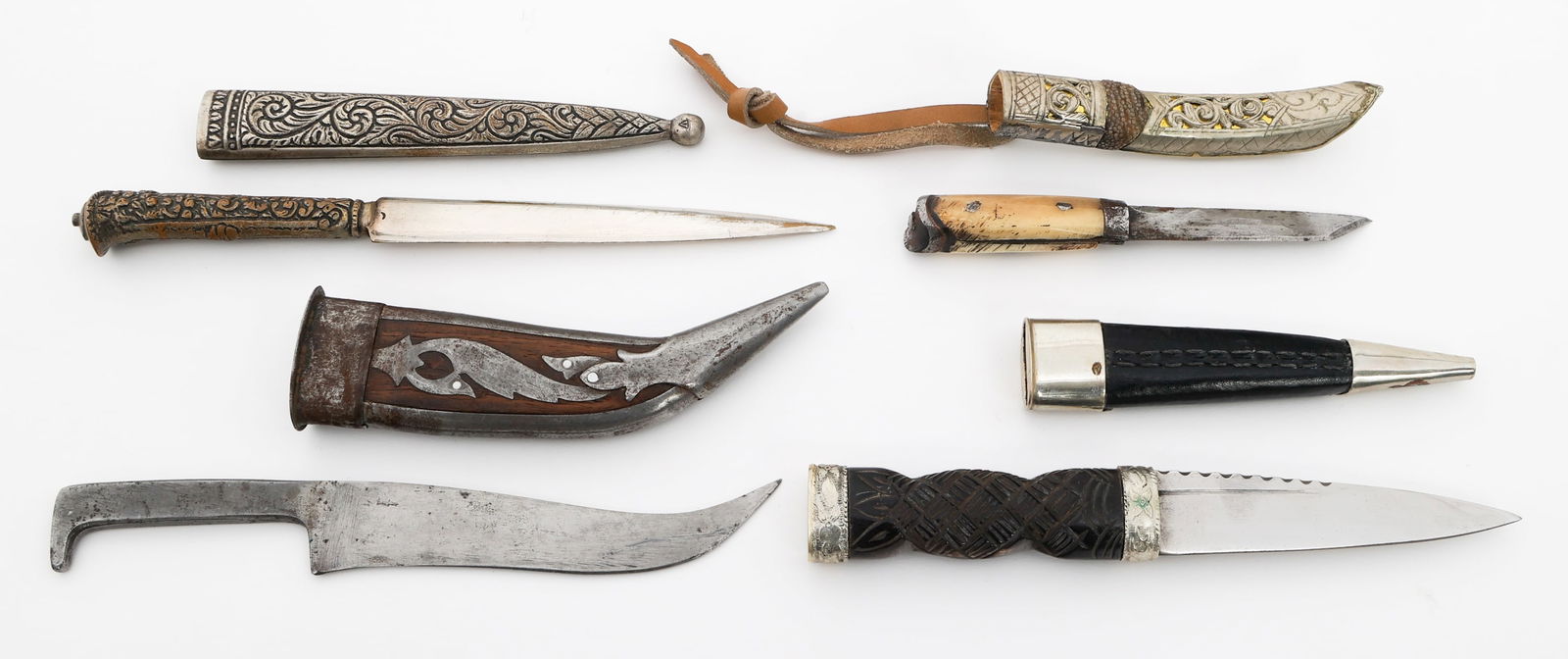 MINIATURE PERSIAN, SCOTTISH & TURKISH DAGGERS: MINIATURE PERSIAN, SCOTTISH & TURKISH DAGGERS Miniature Persian, Scottish and Turkish Daggers. All have scabbards. Blade Length: 2 7/8" to 5 1/8" Total Length: 5 1/4" to 8 1/4" Provenance: Lifetime Ed