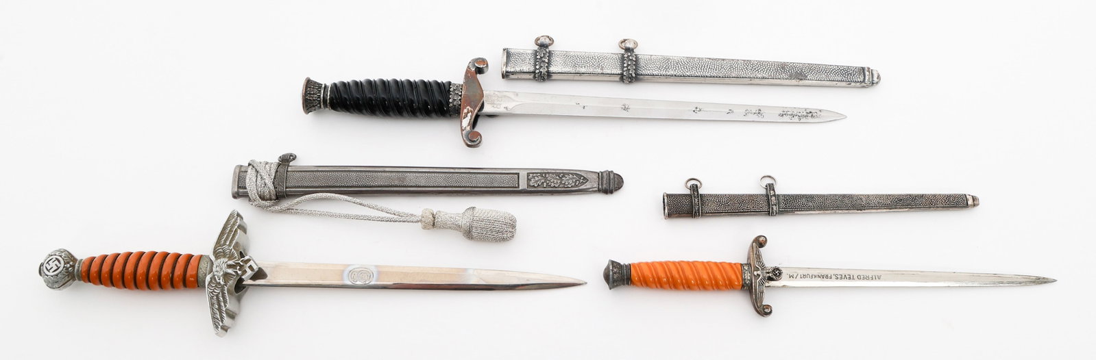 MODERN MINIATURE COPIES OF GERMAN DAGGERS: MODERN MINIATURE COPIES OF GERMAN DAGGERS Modern Miniature Copies of German Daggers with Scabbards. (1) Railroad Protection. (1) 2nd model Luftwaffe. (1) Heer with portepee. Blade Length: 5" to 6 3/8"