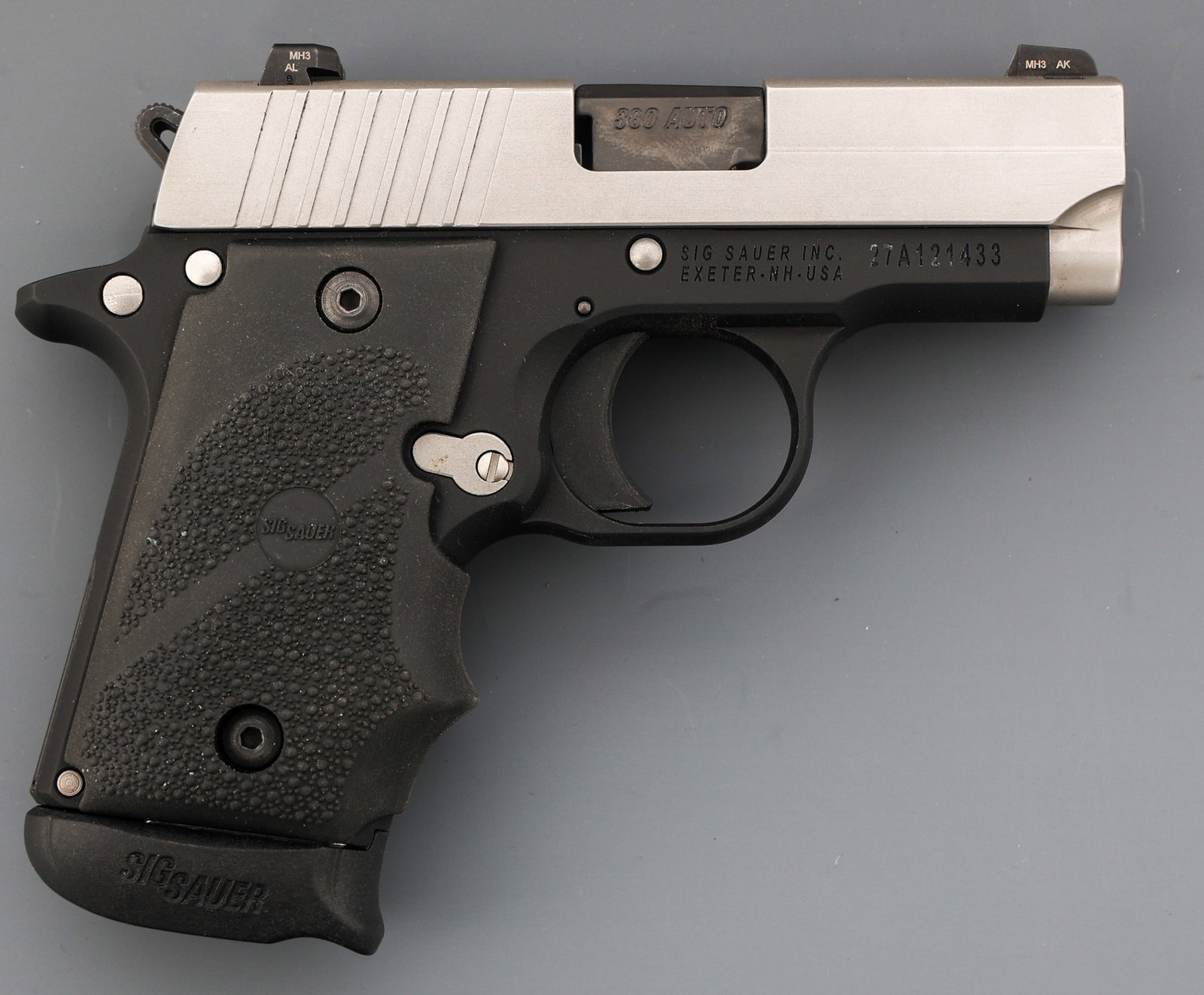 SIG SAUER MODEL P238 .380 AUTO SEMI AUTO PISTOL: SIG SAUER MODEL P238 .380 AUTO SEMI AUTO PISTOL Sig Sauer Model P238 .380 Auto caliber semi-automatic pistol. Fixed sights. Textured rubber grips. One magazine. Holster. Black hard plastic case with l