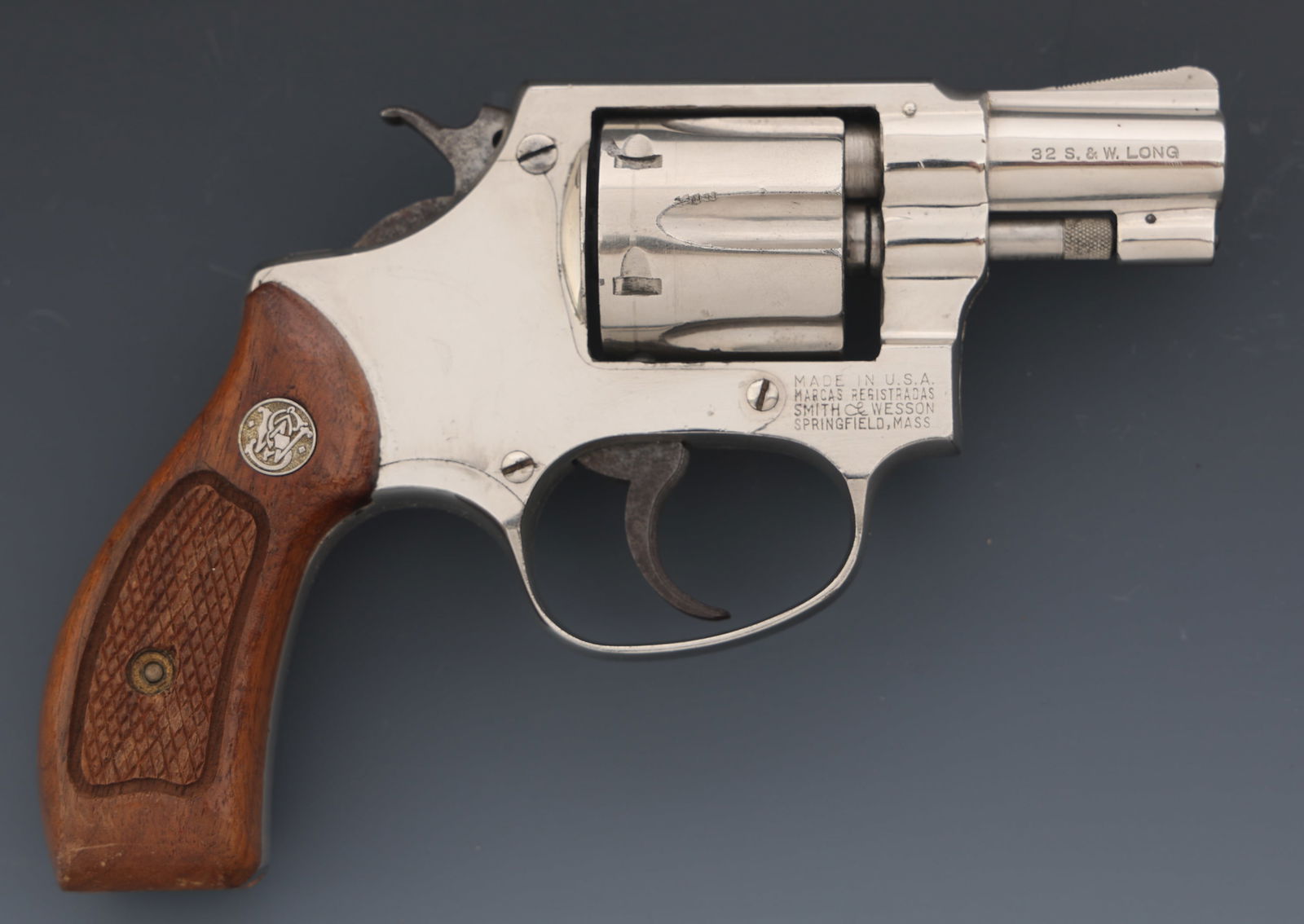 SMITH & WESSON PRE-MODEL 30 .32 S&W LONG REVOLVER: SMITH & WESSON PRE-MODEL 30 .32 S&W LONG REVOLVER Smith & Wesson Postwar Pre-Model 30 .32 S&W Long caliber DA revolver. Nickel finish. Fixed sights. Six-shot fluted cylinder. Checkered wood grips with